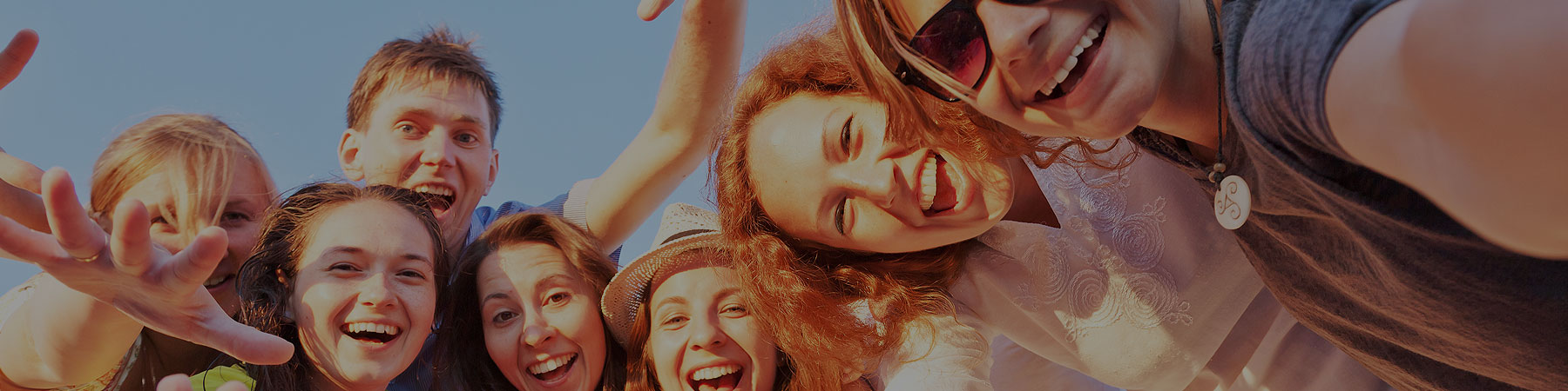 group of teens together smiling and having fun